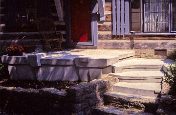 Porch and steps at the front of a log house 1