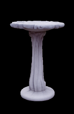 A bird bath with plant forms on its pedestal